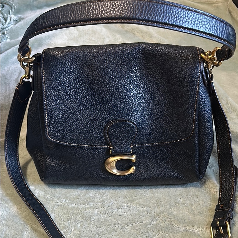 Black and Gold Crossbody Bag with Adjustable Strap and Gold Hardware